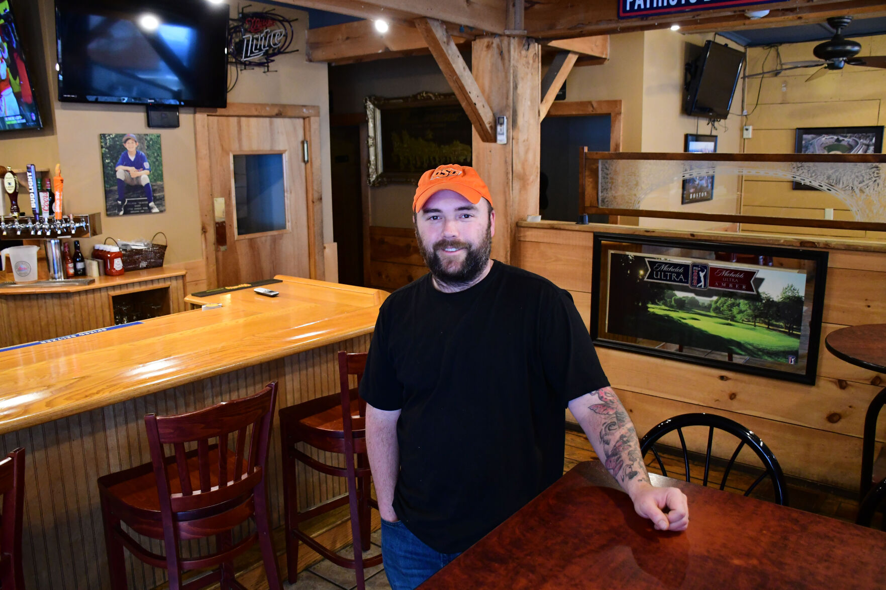 Bradbury stands in the dining room and bar of the restaurant